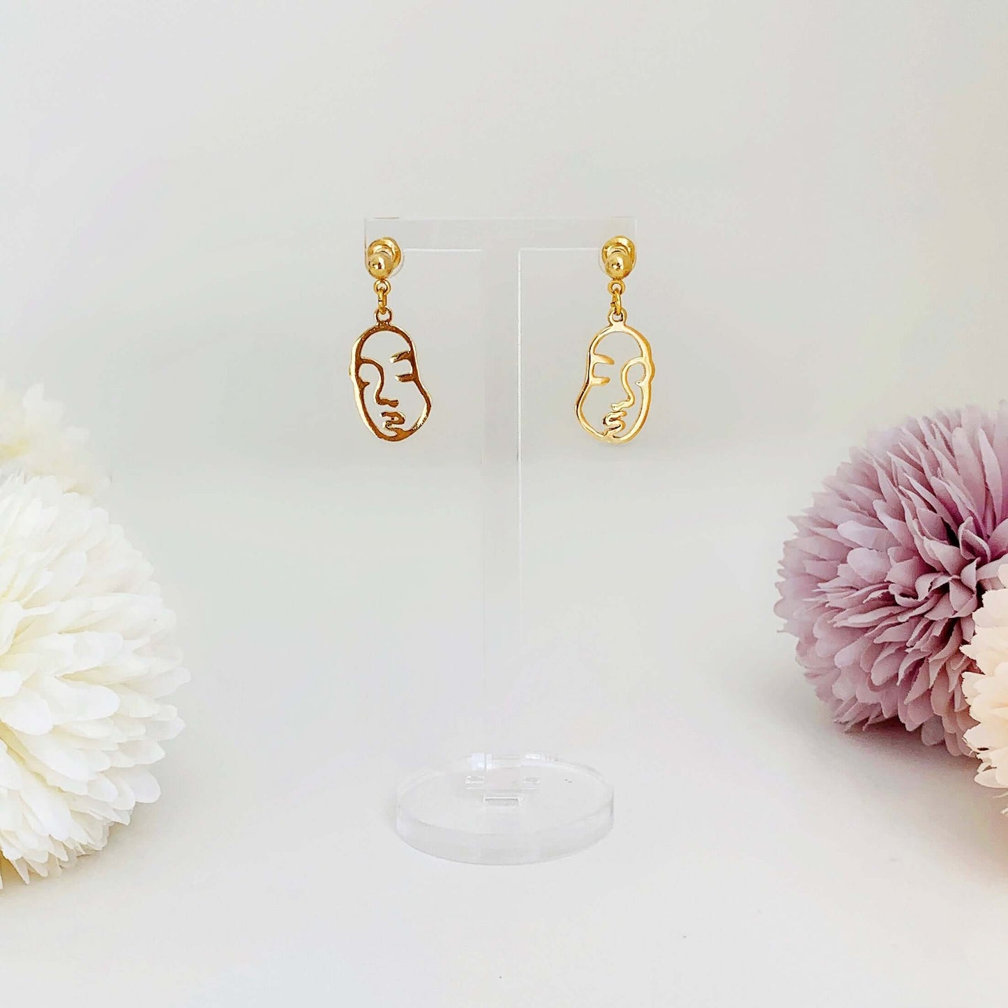 gold abstract face charm earrings